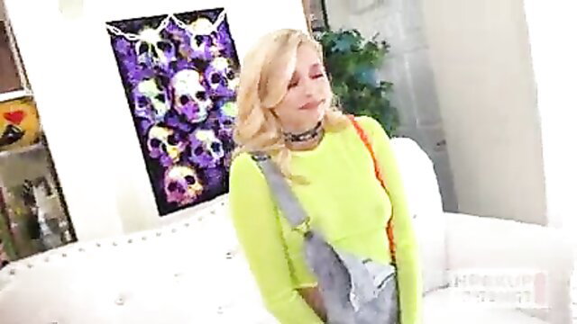 Blonde Carolina Sweets in neon green top and denim overalls