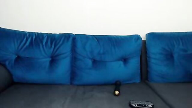 Amelia Anderson striptease on blue velvet couch with dildo