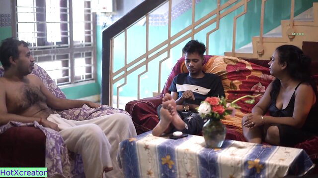 Indian bhabhi chats with naughty desi devar on couch in hot threesome tease