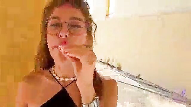 Hot brunette in glasses licks lips teasing blowjob outdoors