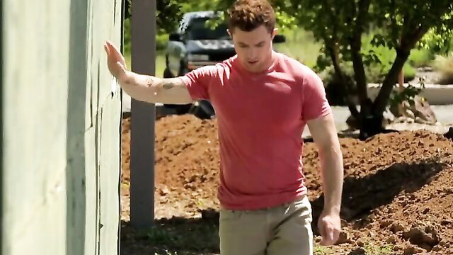 Mark Long flexing muscles outdoors in tight red tee, raw gay porn star
