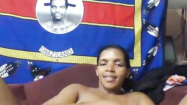 Ebony babe with big tits flashes on webcam in Swaziland flag room