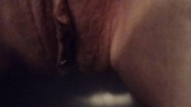 Closeup of Moonbaby's wet shaved pussy peeing in bathroom