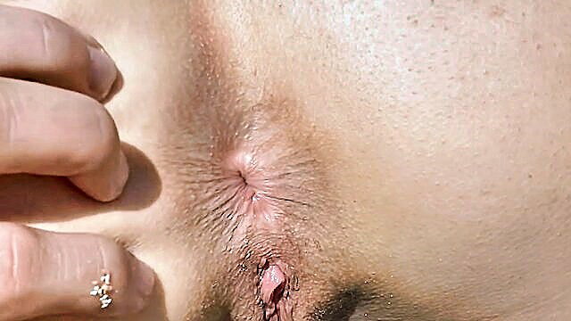 Sofia David fingers shaved pussy closeup on Greece beach