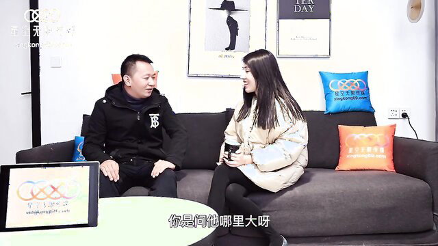 Asian wife in lingerie interviewed by man on couch, sexy big tits tease