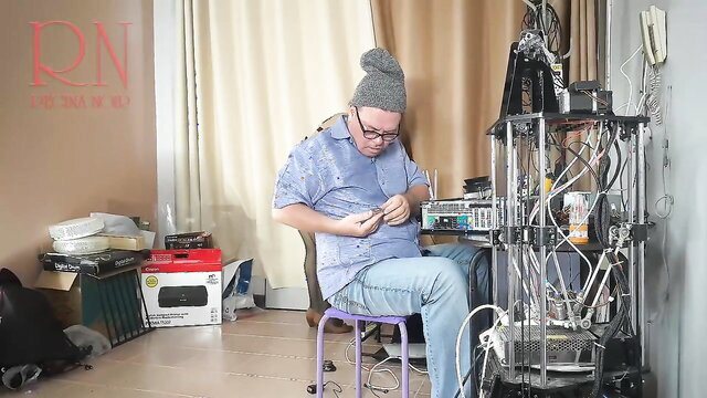 Stupid IT engineer in messy office with tech gear, real amateur cam