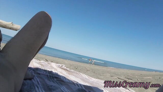 MissCreamy nude legs spread on Canary beach risky HJ tease