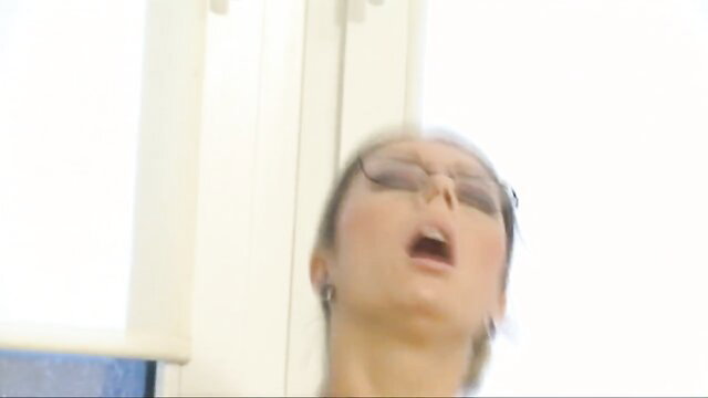 Asian office girl in glasses moaning with open mouth closeup