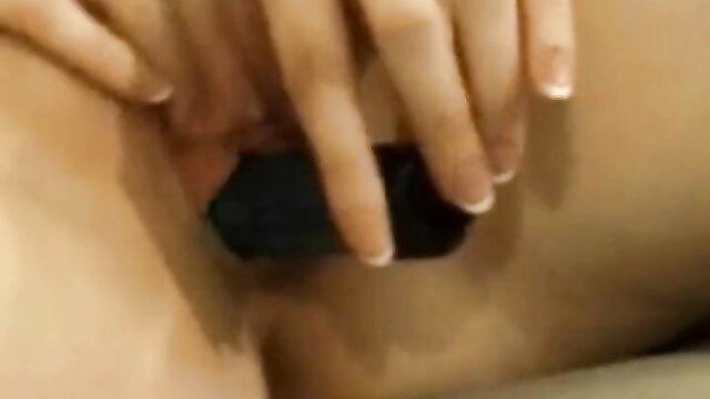 Asian babe fingers pussy with black dildo closeup