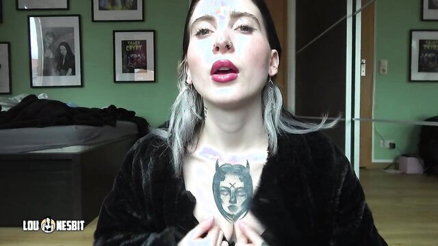 Lou Nesbit tattooed stepmom in fur, seductive gaze by Lia Louise