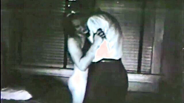 Vintage couple embracing intimately in sheer dress, passionate hug