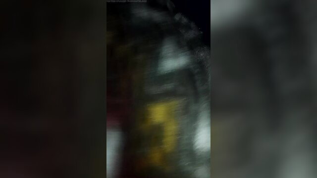 Blurry XXX 2023 adult scene with yellow glow and dark silhouettes