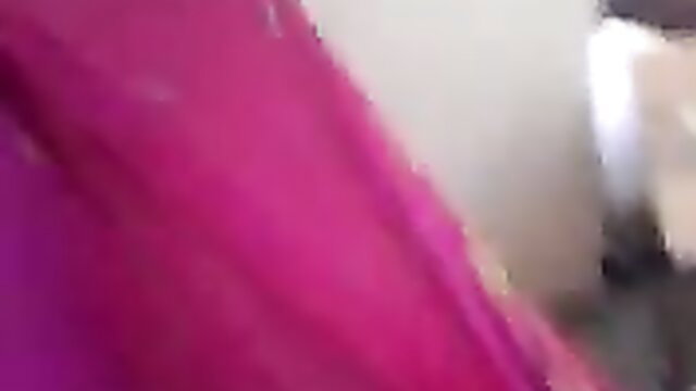 Indian mature lady in pink saree, closeup teasing smile lips