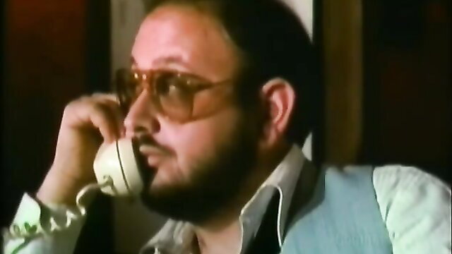 Man on retro phone in Platinum Paradise 1980 porn thumbnail