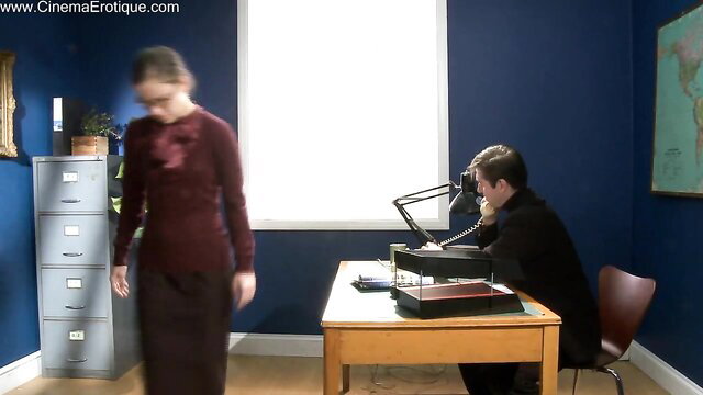 Nerdy guy on phone gets deep throat from brunette in office