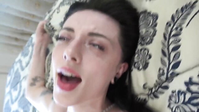 Kitty Cam moans in ecstasy on bed, amateur closeup face