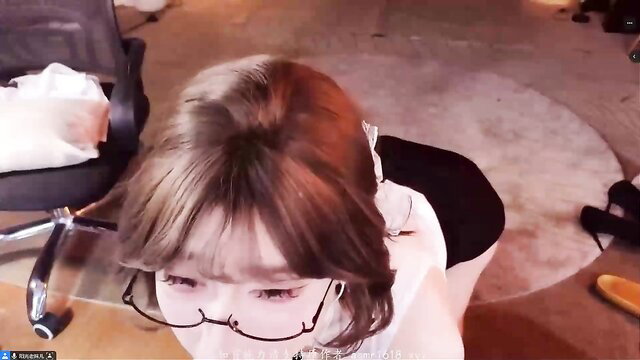 Asian girl with glasses in white top and black skirt, close-up ASMR tease