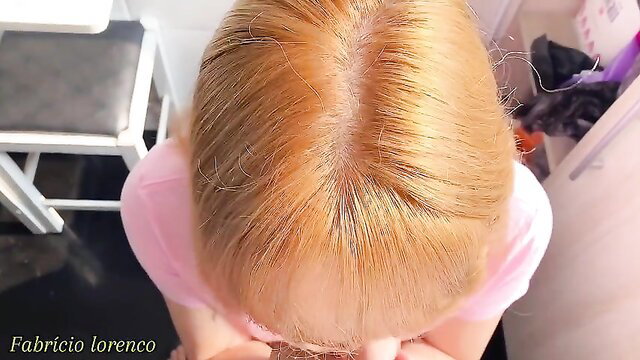 Blonde teen stepdaughter top-down view in pink top, closeup hair