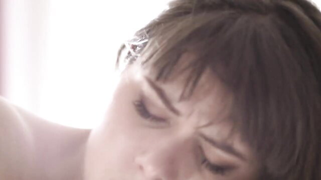 Closeup of French amateur brunette's aroused face in ecstasy