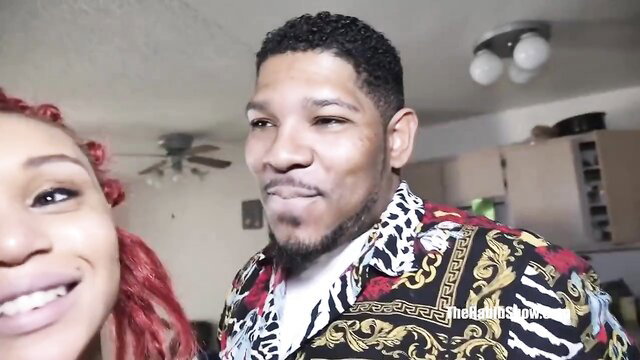 Ebony redhead with muscular black guy smiling in kitchen