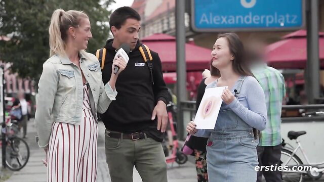 Blonde ponytail & Asian girls flash pussy drawing to guy on Alexanderplatz street