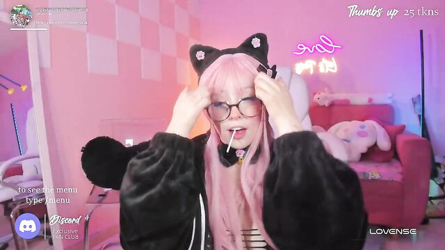 Pink-haired Asian webcam girl in cat ears teases with lollipop