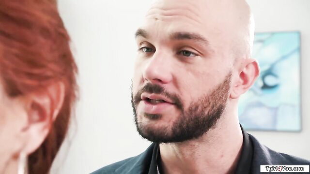 Bald bearded guy aroused by t-girl in backless dress closeup