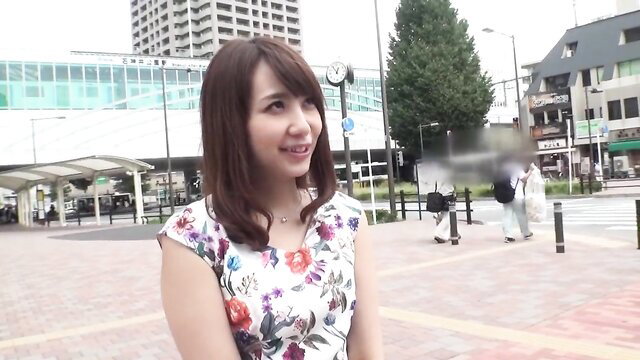 Japanese woman in floral dress smiles at JAV street interview 300MIUM-332