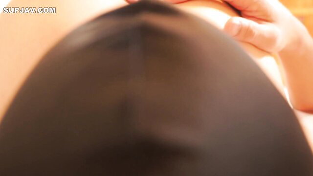 Asian JAV babe's huge tits squeezed by hand closeup