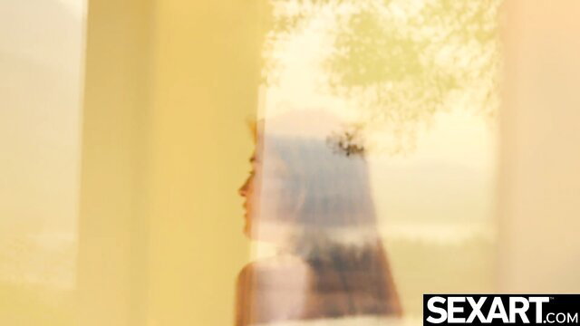 Jia Lissa profile silhouette in yellow light, erotic solo tease