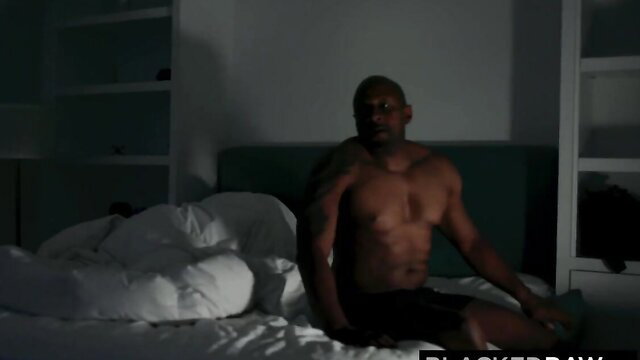 Muscular black man shirtless in bed, Blacked Raw interracial scene