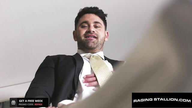 Suited Latino man smiling in suit and yellow tie closeup
