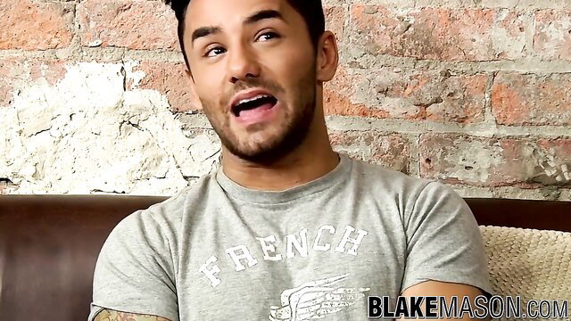 Muscular hunk Blake Mason with tattoos in gray French tee shirt