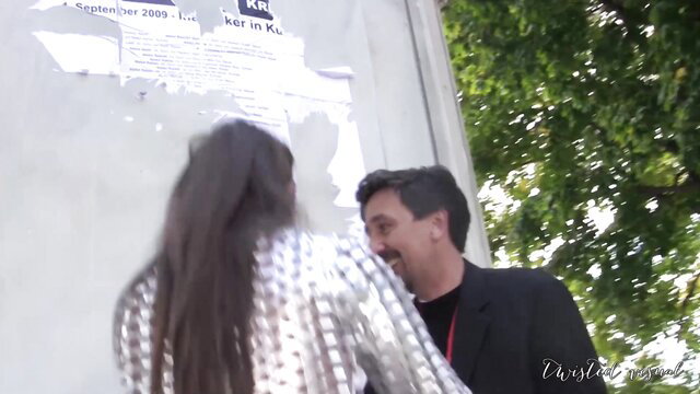 Dana Vespoli in sexy silver dress chats with man in public erotic scene