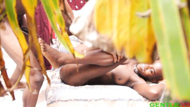 Nude black teen boy lying legs spread wide on bed in amateur scene