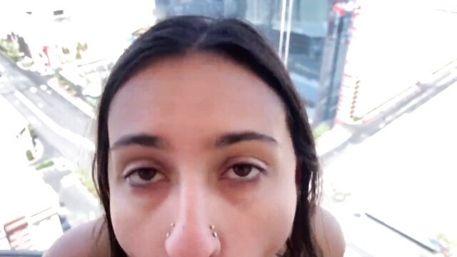 Closeup of sexy Indian Hailey Rose with nose ring in Vegas high-rise