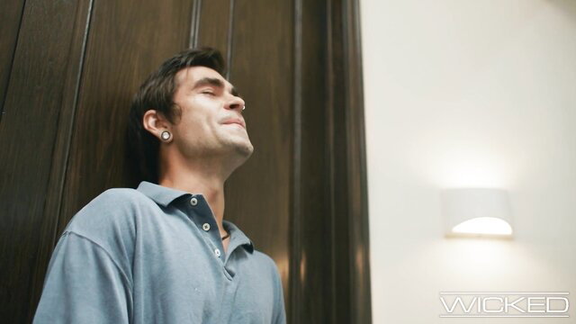 Hot guy in ecstasy leaning against door in steamy Wicked scene