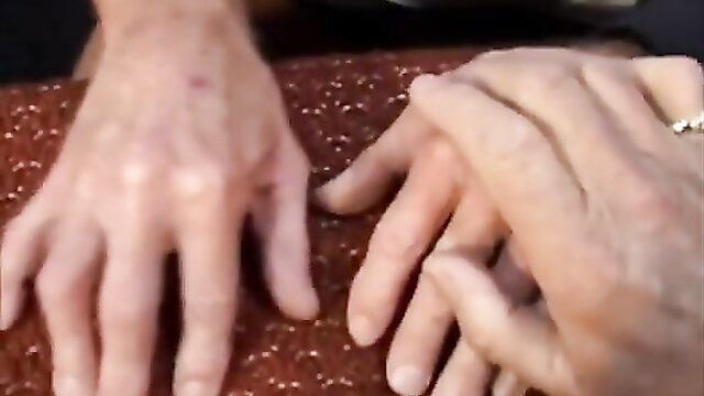 Grandpa's wrinkled hands gripping teen on red surface in taboo porn