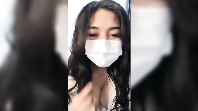 Zara Gladys Indonesian beauty in mask flashing huge cleavage
