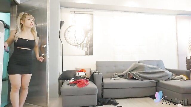 Hot Asian babe Lina in mini dress watches sleeping man in apartment