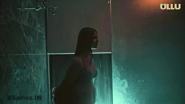 Indian woman showering in bra, wet silhouette from Corporate web series