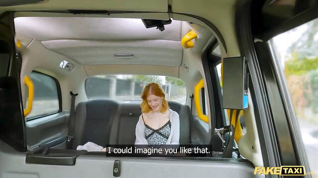 Fake Taxi redhead babe in lingerie chats seductively in cab