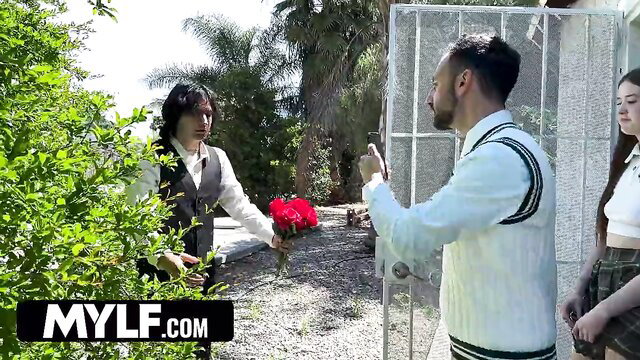 MILF in schoolgirl skirt gets roses from suited guys at gate