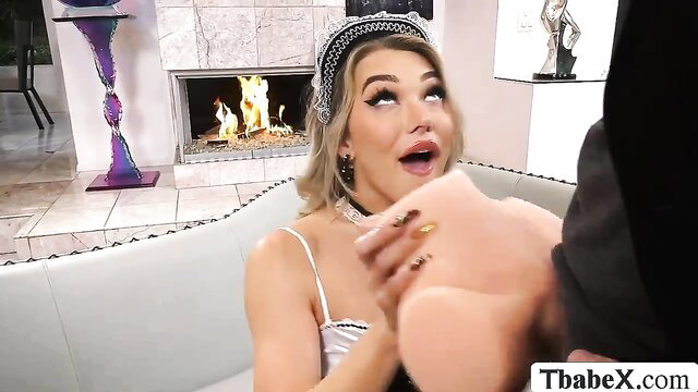 TS maid with blonde hair sucks big cock closeup in lingerie