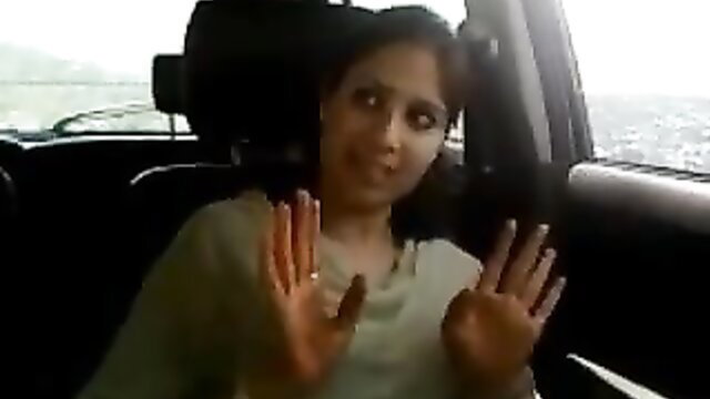Horny Indian girl in car with hands up, ready for blowjob action