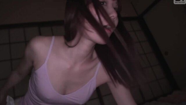 Asian beauty in pink tank top with long dark hair, seductive gaze