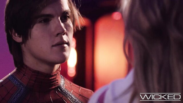 Spider-Man in red suit stares intensely at blonde in Wicked Spidey Pool scene
