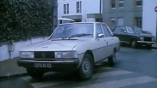 Vintage 1984 Porsche 304 car parked on wet street, Herzog film thumbnail