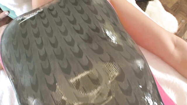 Sexy swimmer in glossy wet swimsuit, teasing body on bed