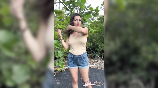 Alina Angel in tank top and denim shorts, outdoor tease